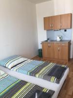 A bed or beds in a room at Šariš rooms