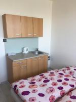 A bed or beds in a room at Šariš rooms