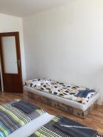 A bed or beds in a room at Šariš rooms