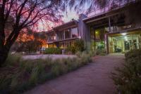 a building with a sidewalk in front of it at YHA Apollo Bay Eco in Apollo Bay