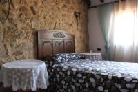 Postel nebo postele na pokoji v ubytování Casa Rural El Palatino