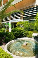 a small pool of water in front of a building at Athinais Hotel in Athens