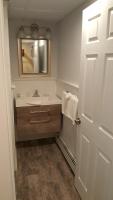 a bathroom with a sink and a mirror at Atlantic Motel in Point Pleasant Beach