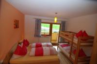 A bed or beds in a room at Landhaus Oberlehen
