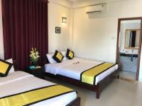 Quynh Chau Homestay Hội Anにあるベッド