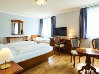 A bed or beds in a room at Das Grüne Hotel zur Post - 100 % BIO