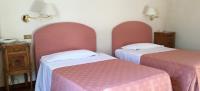 Posteľ alebo postele v izbe v ubytovaní Hotel Gattapone