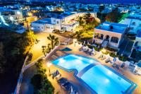 una vista aérea de una villa con piscina por la noche en Hotel Lodos, en Karterados