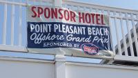 a sign for a point pleasant beachophone grand prize on a building at Atlantic Motel in Point Pleasant Beach