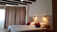 A bed or beds in a room at Eva Studios