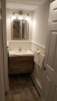 a bathroom with a sink and a mirror at Atlantic Motel in Point Pleasant Beach