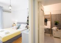 A bed or beds in a room at Attractive Flat near the Acropolis Museum & Metro Station by Athenian Homes