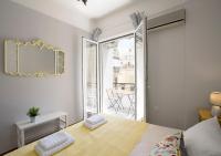 A bed or beds in a room at Attractive Flat near the Acropolis Museum & Metro Station by Athenian Homes