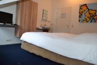 Een bed of bedden in een kamer bij Hotel-Restaurant Het Rechthuis