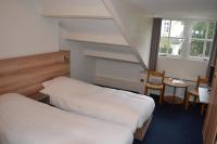 Een bed of bedden in een kamer bij Hotel-Restaurant Het Rechthuis