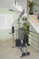 an exercise bike in a room with stairs at Apartment Beach in Makarska