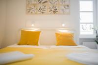 Posteľ alebo postele v izbe v ubytovaní Rába Apartman House