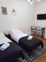 Posteľ alebo postele v izbe v ubytovaní Apartamenty METRO Targówek