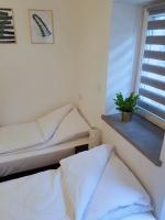 Posteľ alebo postele v izbe v ubytovaní Apartamenty METRO Targówek