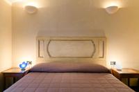 Posteľ alebo postele v izbe v ubytovaní Sirmio Apartments - Primavera Stay