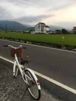 a bike parked on the side of a road at Yilan Real Fun Homestay in Dongshan