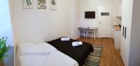Posteľ alebo postele v izbe v ubytovaní Apartamenty METRO Targówek