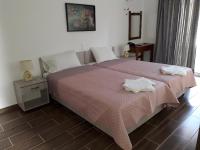 Postel nebo postele na pokoji v ubytování Petasos Apartments 1