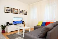 Televízia a/alebo spoločenská miestnosť v ubytovaní Le Monde Apartment