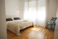 Posteľ alebo postele v izbe v ubytovaní Le Monde Apartment