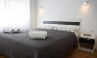 Posteľ alebo postele v izbe v ubytovaní Le Monde Apartment