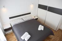Posteľ alebo postele v izbe v ubytovaní Le Monde Apartment