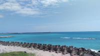 a beach with a bunch of chairs on the beach at Sweet Rainbow B&amp;B in Hualien City