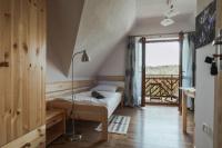 Posteľ alebo postele v izbe v ubytovaní Przy Szlaku Zakopane centrum pokoje & apartamenty