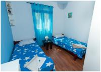 Łóżko lub łóżka w pokoju w obiekcie Apartments FRAGOLINA