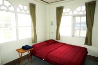 Postel nebo postele na pokoji v ubytování Roo Poo Guest House