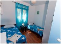 Łóżko lub łóżka w pokoju w obiekcie Apartments FRAGOLINA