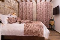 Posteľ alebo postele v izbe v ubytovaní Studio Amore in Diocletian palace