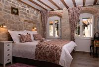 Posteľ alebo postele v izbe v ubytovaní Studio Amore in Diocletian palace