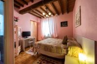 Posteľ alebo postele v izbe v ubytovaní La Fossetta B&B