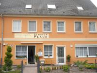 a orange building with a sign that reads permission palace at Apart Pension Plaue in Brandenburg an der Havel