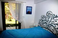 A bed or beds in a room at Dio Guesthouses