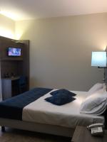 A bed or beds in a room at Hotel Mediterranée