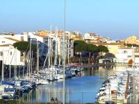 a bunch of boats docked in a marina with buildings at Hotel Alhambra in Cap d&#39;Agde