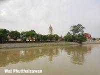 a view of a river with a tower in the background at Baan Baimai Boutique Room in Phra Nakhon Si Ayutthaya