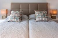 A bed or beds in a room at Ag Casa Del Mar Premium