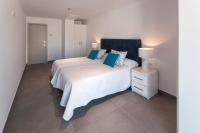 A bed or beds in a room at Ag Casa Del Mar Premium