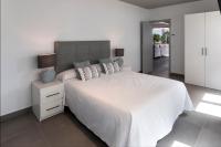 A bed or beds in a room at Ag Casa Del Mar Premium