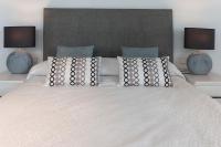 A bed or beds in a room at Ag Casa Del Mar Premium