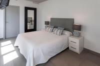 A bed or beds in a room at Ag Casa Del Mar Premium