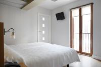Łóżko lub łóżka w pokoju w obiekcie Hotel Olatu